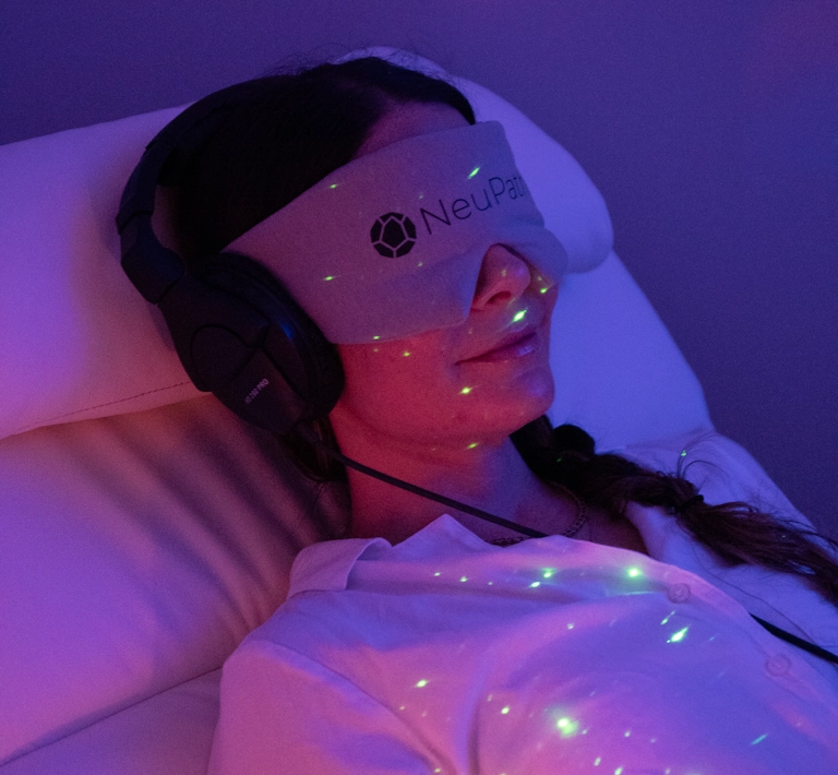 A woman relaxes while participating in ketamine infusion therapy at NeuPath Mind Wellness in Delray Beach, FL